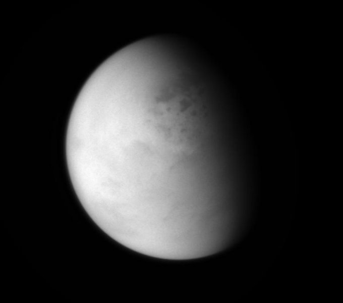 The Cassini spacecraft peers down though layers of haze to glimpse the lakes of Titan's northern regions.  The view was obtained at a distance of approximately 114,000 miles (183,000 kilometers) from Titan.   Image Credit:     NASA/JPL-Caltech/Space Science Institute