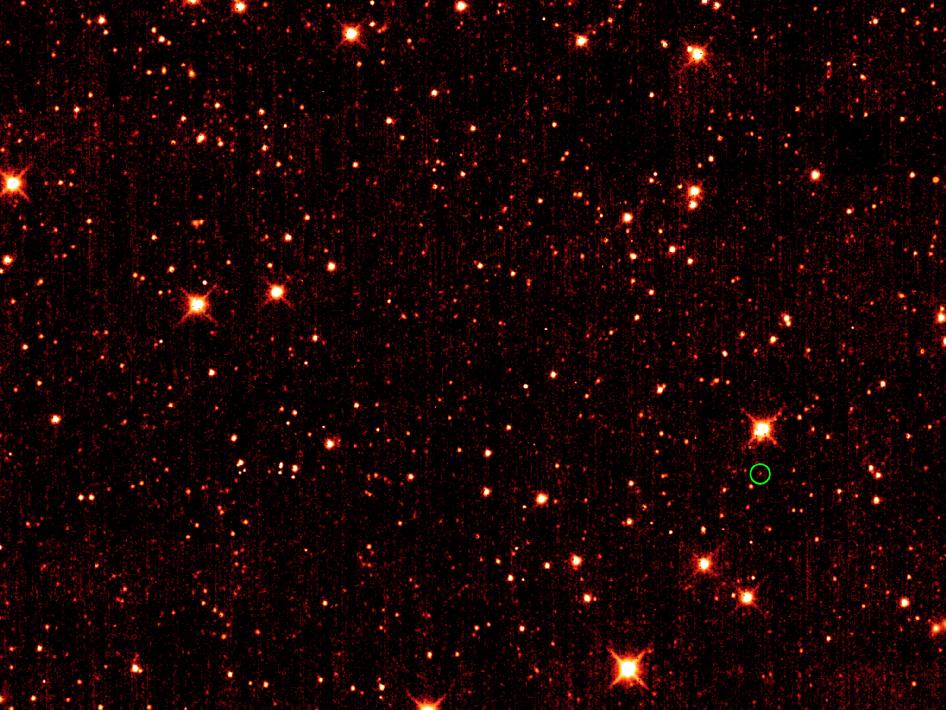 Asteroid 2010 TK7 is circled in green, in this single frame taken by NASA's Wide-field Infrared Survey Explorer, or WISE. Image credit: NASA/JPL-Caltech/UCLA Asteroid 2010 TK7 is circled in green, in this single frame taken by NASA's Wide-field Infrared Survey Explorer, or WISE. Image credit: NASA/JPL-Caltech/UCLA