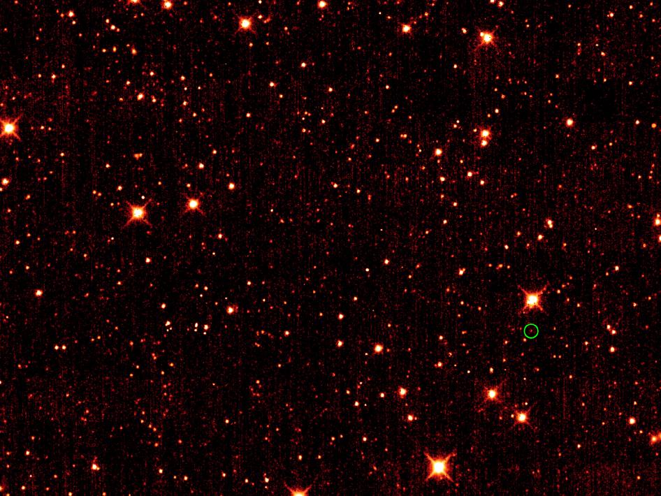 Asteroid 2010 TK7 is circled in green, in this single frame taken by NASA's Wide-field Infrared Survey Explorer, or WISE. Image credit: NASA/JPL-Caltech/UCLA