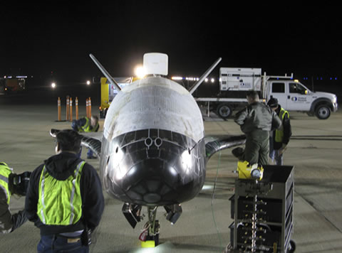 The X-37B is shown here after completing its first experimental test mission. Photo credit: Boeing