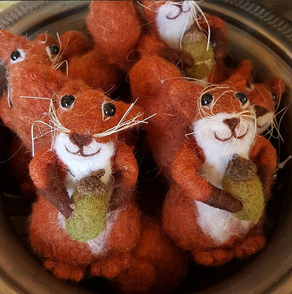 A display of cheerful squirrel Christmas decorations.
