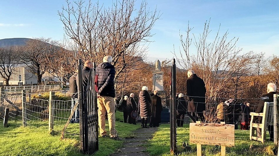 People gather at the Staffin War Memorial.