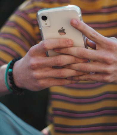 Man typing on a phone