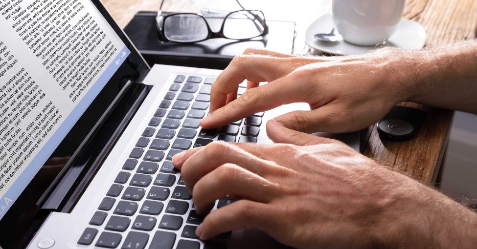 Working on a Laptop at a Home Office Desk