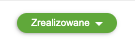 Zielony przycisk z napisem 'Zrealizowane' i strzałką wskazującą rozwijaną listę opcji wskazujący status dla dokumentu zamówienie.
