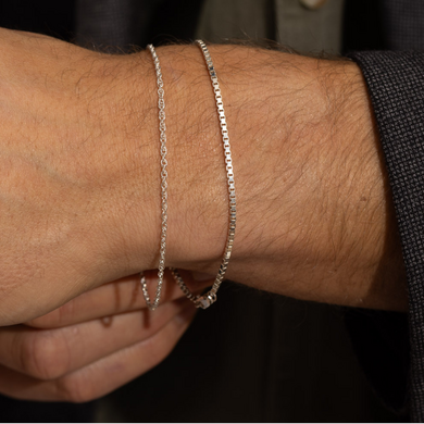 Our men's Tessera Bracelet made up of strong, interlocking cubes resembles a slender stream of solid silver 
