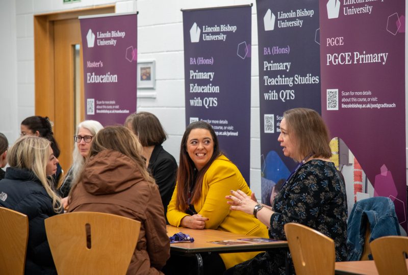 Student and parents attending an open day, and discussing the course details