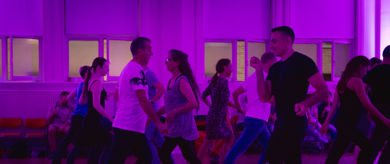 A photo of people dancing at a Pink Jukebox event.