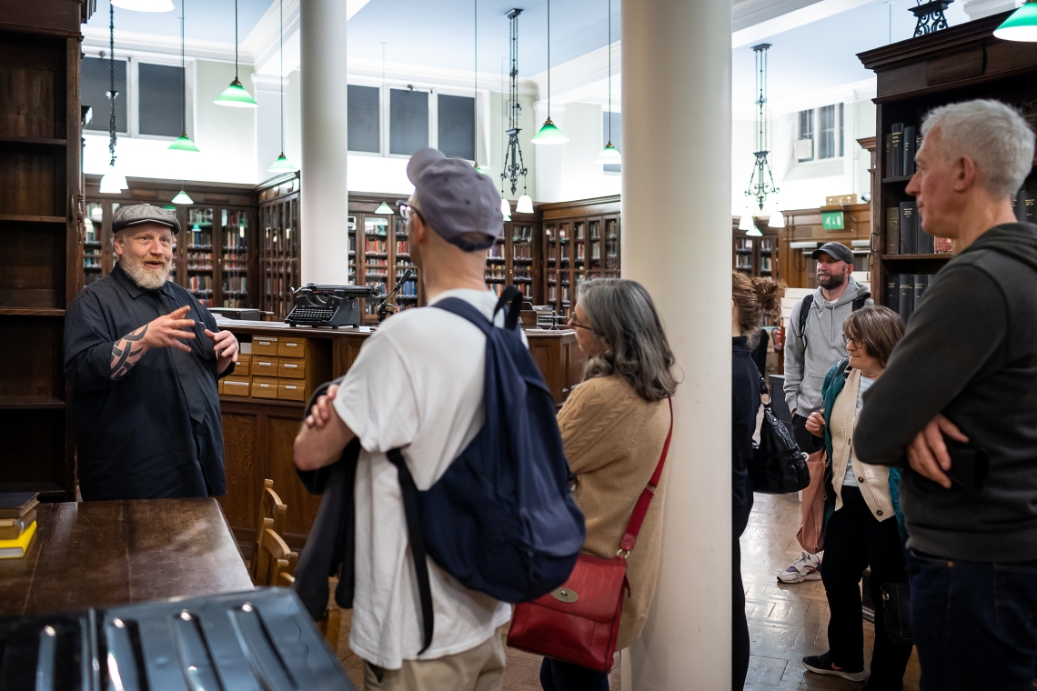 Image from our collection of Stefan Dickers giving a tour of the Library.