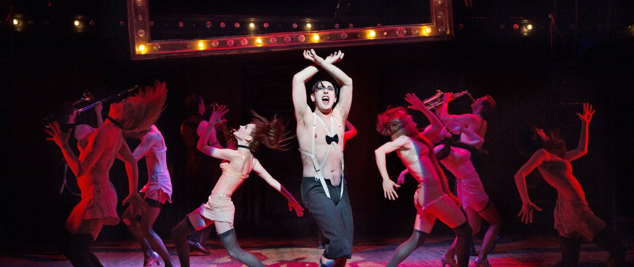 A performance of Cabaret, with performers dancing on stage