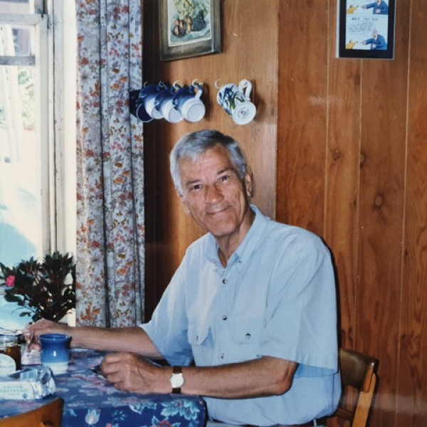Image of Collin Courtney by a dining table.