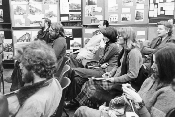 A black and white photo of students sitting in rows. The image is from the London History Workshop Centre Archive