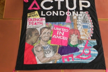 A poster from the Act Up London Archive with drawings of people in London on. They are holding signs such was "United in Anger" and "Silence = Death".
