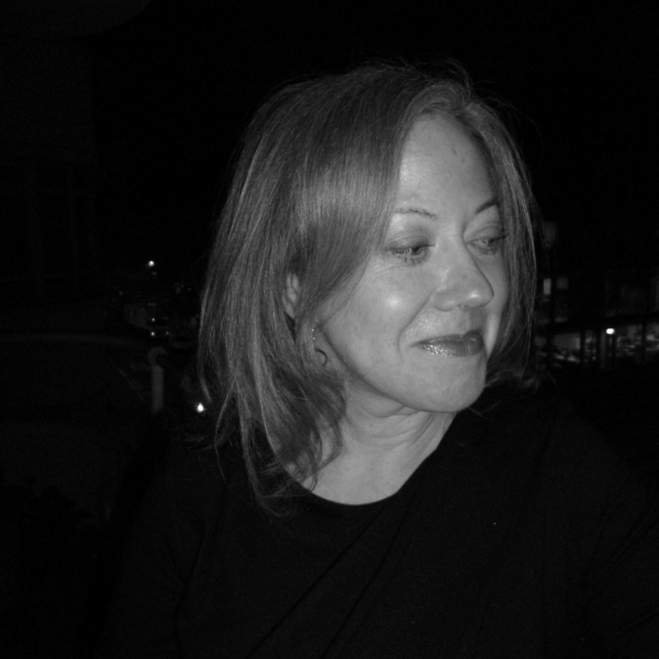 A portrait photo of tutor Sarah Wise. It is a black and white photo.