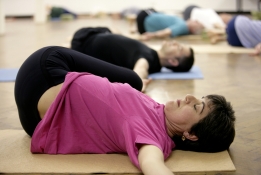 a group taking a Yoga class at Bishopsgate Institute, London