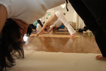 a group taking a Yoga class at Bishopsgate Institute, London