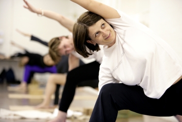 a group taking a Yoga class at Bishopsgate Institute, London