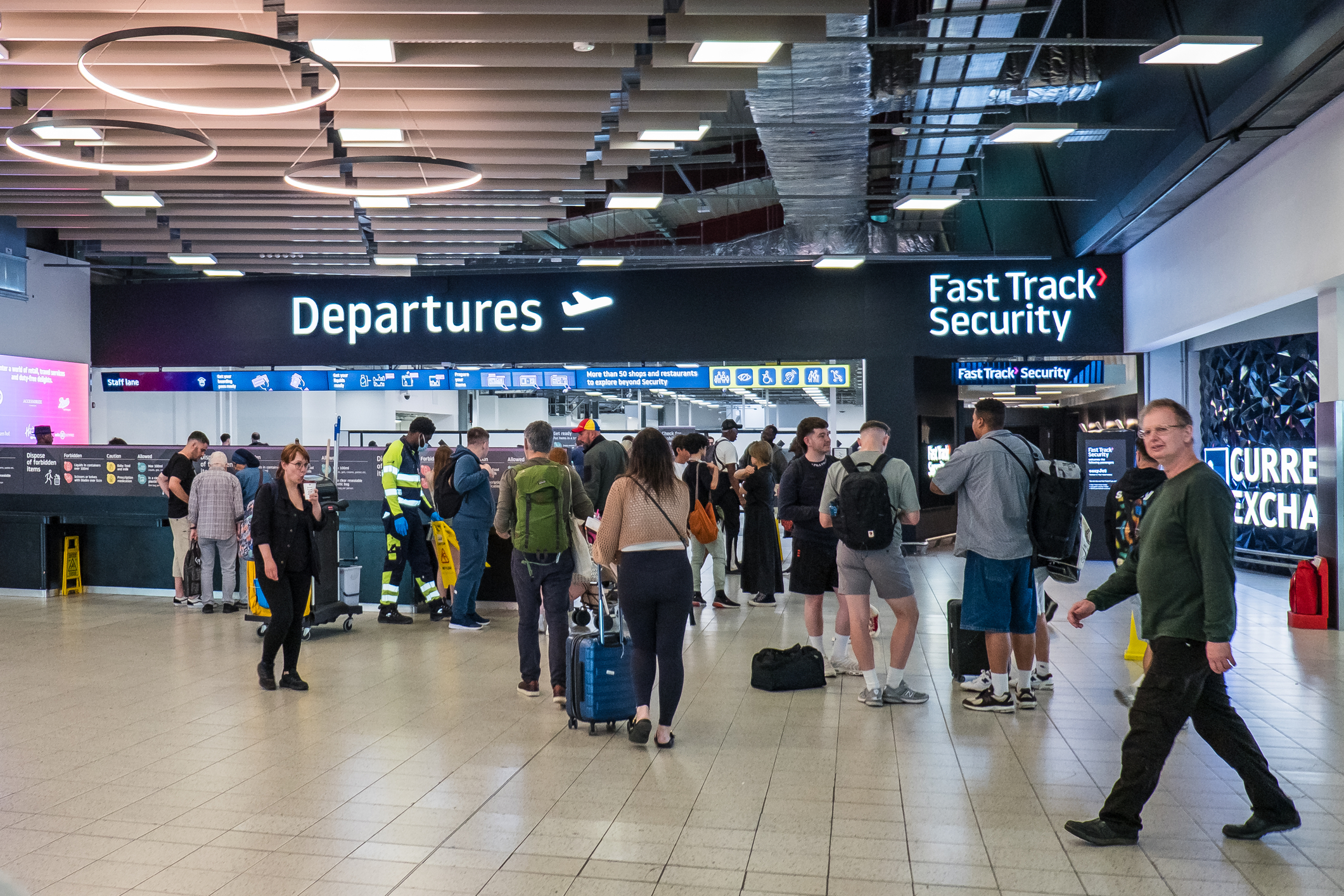 People inside London Luton Airport departure terminal