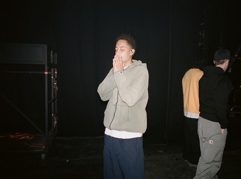 Loyle Carner wears 50-Year old Champion hoodie for headline