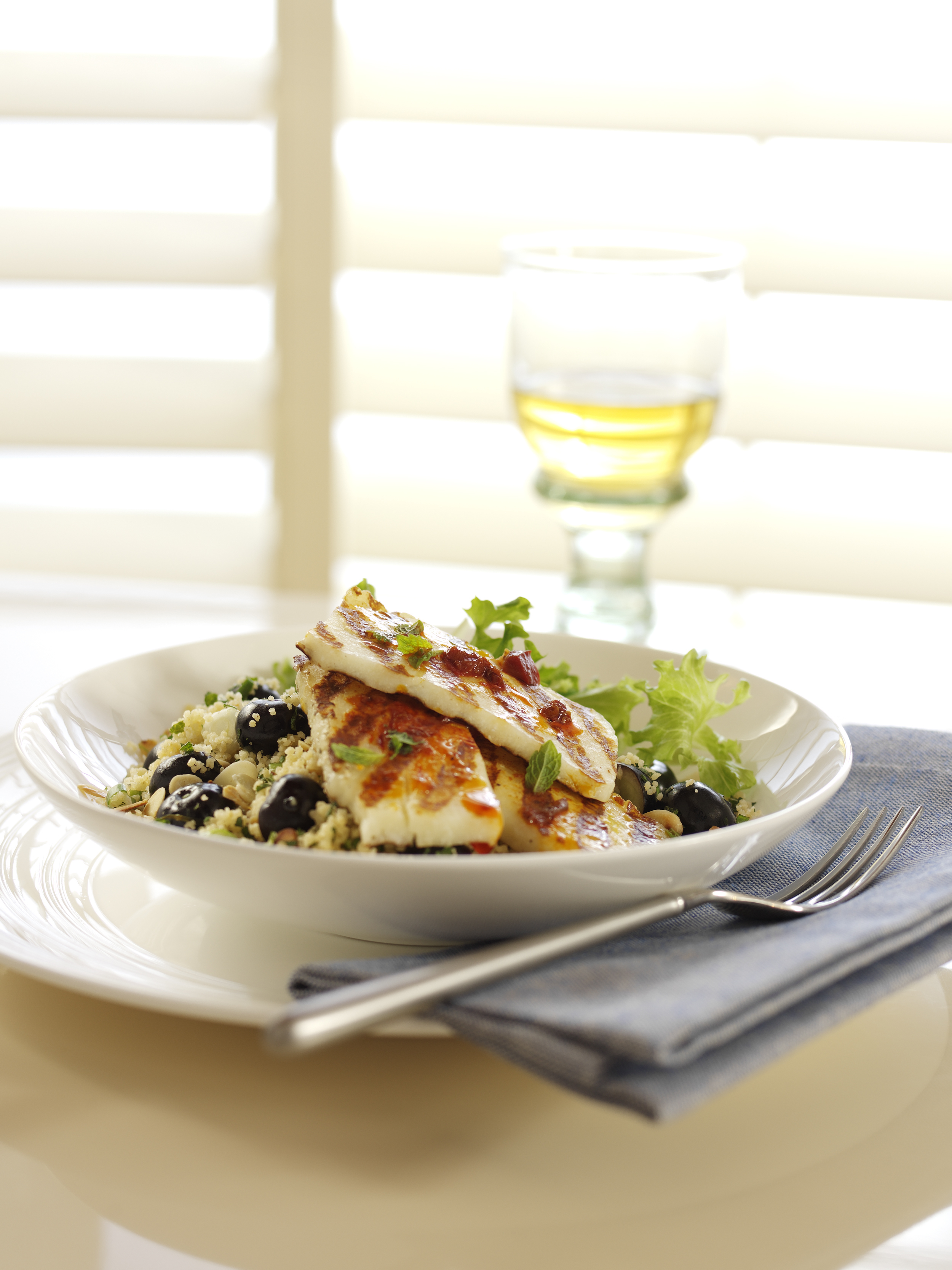 Griddled Harissa Marinated Halloumi with Berry World Blueberry Spring Onion and Toasted Almond Couscous 75istnxwa