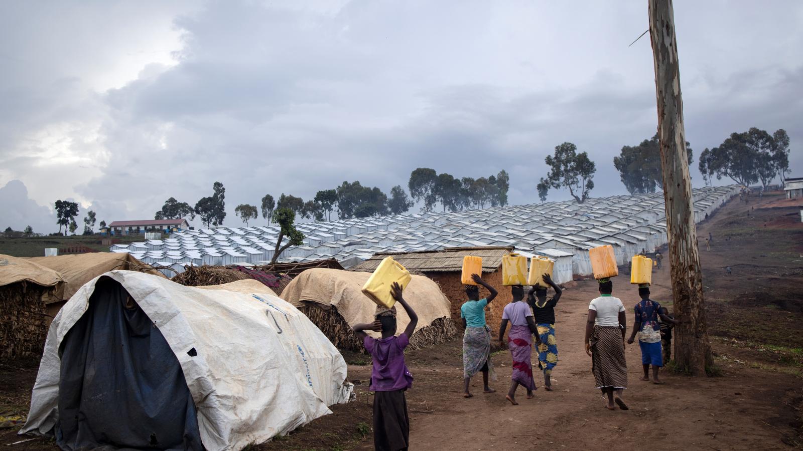 Democratic Republic of the Congo. IDP women collect water.