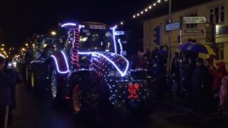 Video: 21 tractors with 39,000 lights drive through a town