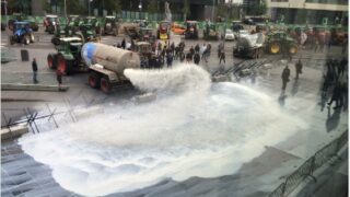 Tankers spray 40,000L of milk over EU buildings in Luxembourg in protest