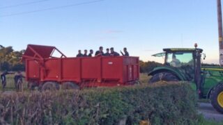 Soccer team hitches lift off tractor and trailer after coach breaks down