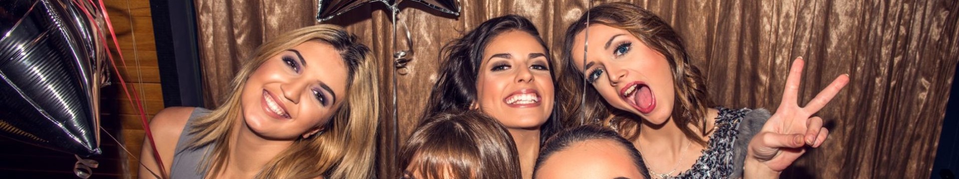 A group of girl celebrating a hen do in a club