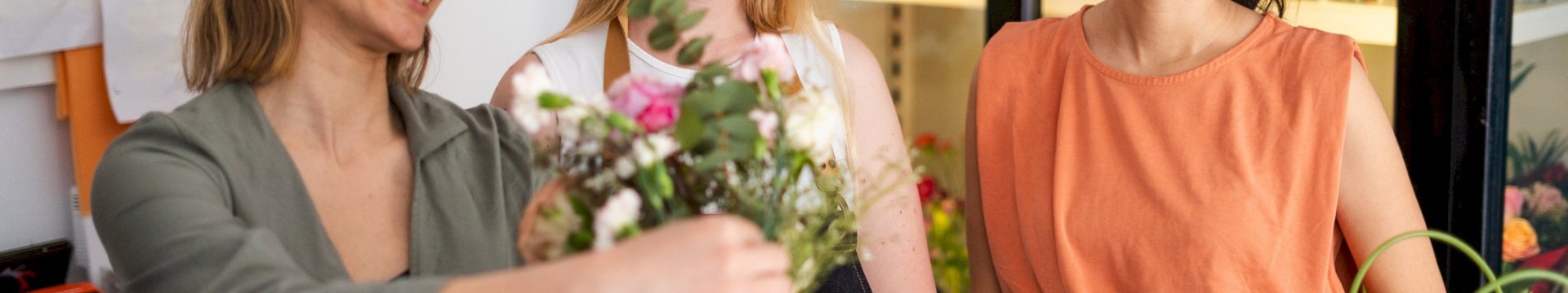 a group of friends creating a bouquet as a part of the hen party