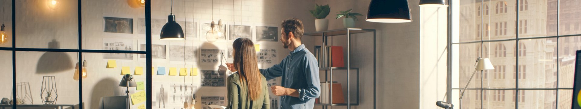 girl and guy looking at art on a wall