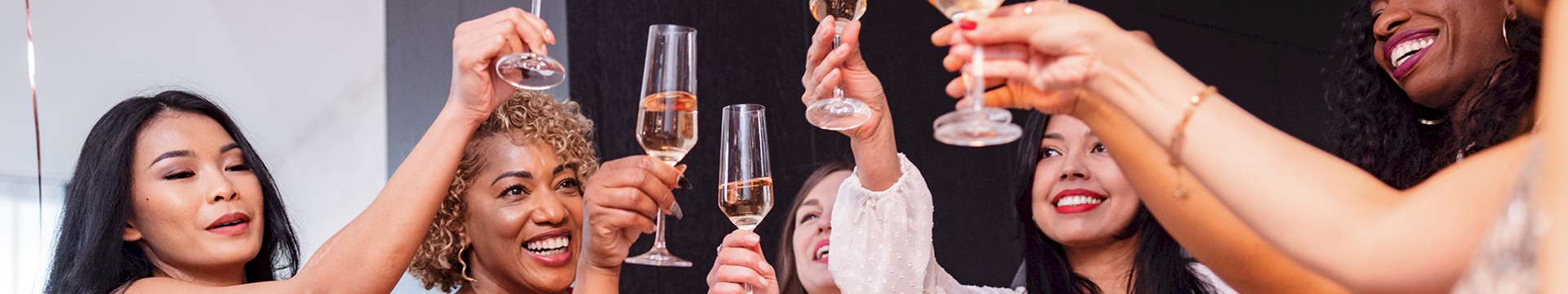 six girls enjoying a glass of prosecco each