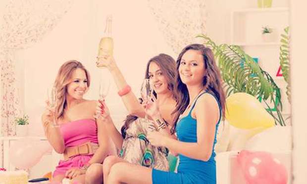 Three girls getting the bubbly flowing. Discover our Hen Parties at Home options today: