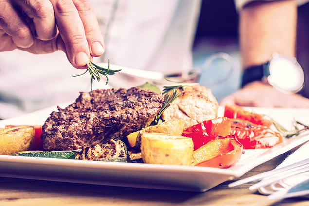 Chef Adding The Finishing Touches