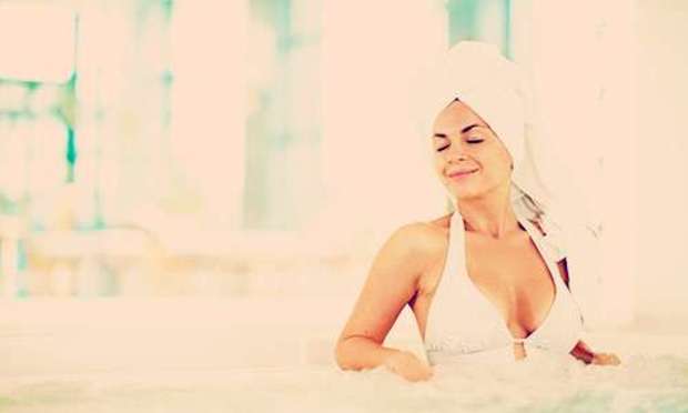 Woman in white bathing suit in a pool. Discover a Cheshire Spa Break for your hen weekend: