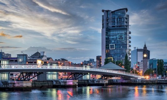 A view of Belfast from the water at dusk