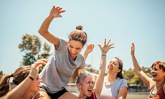 Ladies enjoying an outdoor activity.