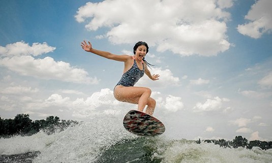 A lady wakeboarding.