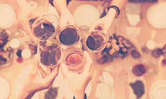 Five glasses of wine held by a hen party. Discover Bristol Wine and Dinner on your hen night: