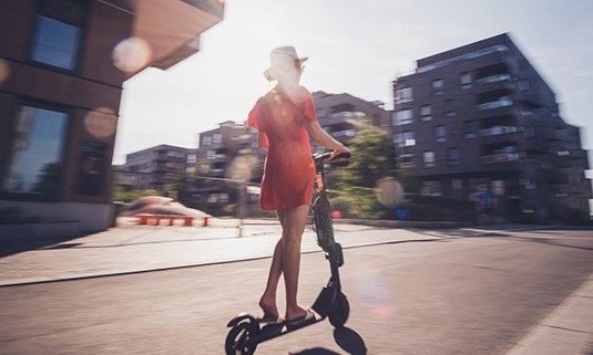 A lady on an electric scooter