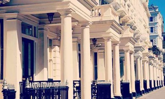 Sun shining on the white columns of Neville Street structures. Discover Chelsea Hen Party ideas below: 