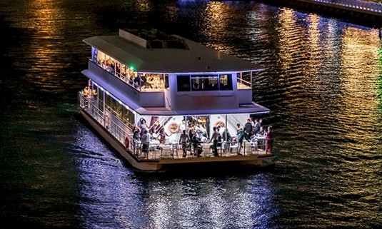 A group of people enjoying a boat party.