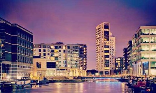 Leeds' Dock under a purple night sky. Discover Leeds Hen Party ideas below: