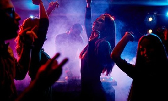 Hen party dancing to music in a nightclub