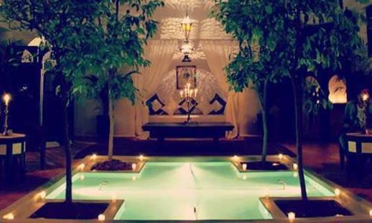 Candlelit pool and sun bed. Get a quote for the Marrakech Luxury Riad on your hen weekend: