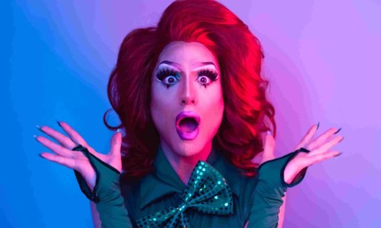 A Drag Queen getting ready to put on a show to a hen  do group