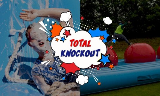 People enjoying the Total Knockout games covered in foam. 