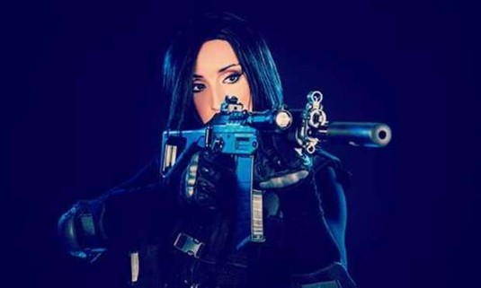 Blacked out woman shooting an assault rifle. Discover Wroclaw Kalashnikov Shooting on your hen do: