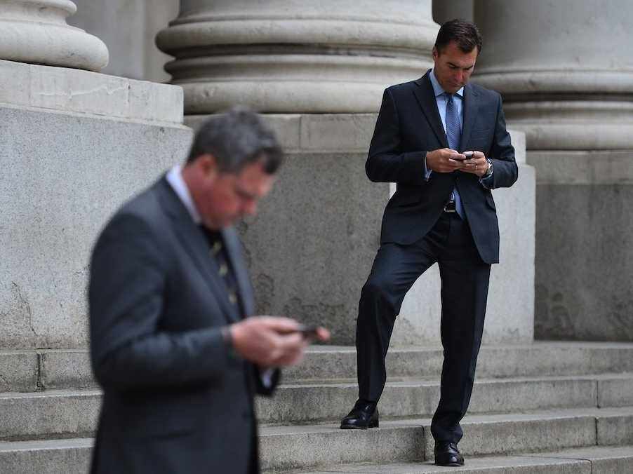 business men using phones