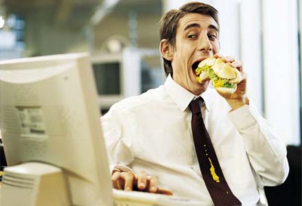 man eating lunch at work